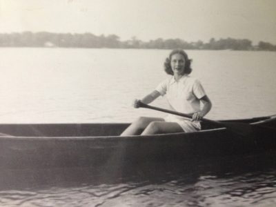 Angela Rensch Ligibel in an early photo at Clark Lake in a favorite canoe.
