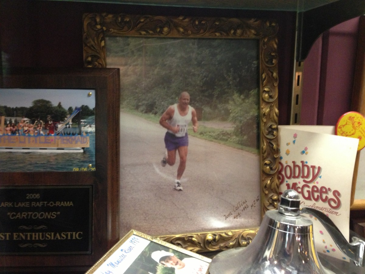 View of a memorabilia display at the Beach Bar.  Included is a photo of Tom Collins running competitively.  