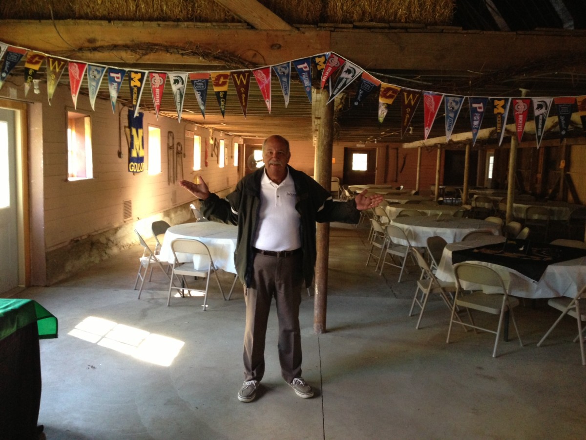 John Karkheck inside the barn.  There is more in the barn than this picture shows.  Lots of team banners and the memorabilia that you won't want to miss seeing.