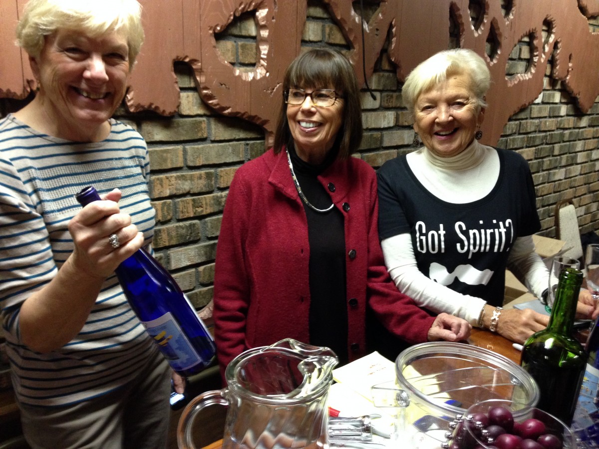 Ann Swain, Peggy Collins and Meredith Szostek at the Clark Lake Spirit Trail wine table.