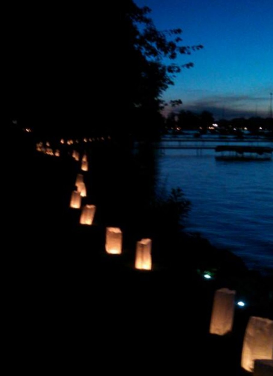 Luminaries lining the shores of Clark Lake.  Photo courtesy of Jill Bentley